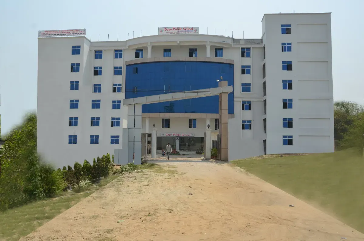 The main building of Doon Public School, Ramzanpur, at the end of the approach road