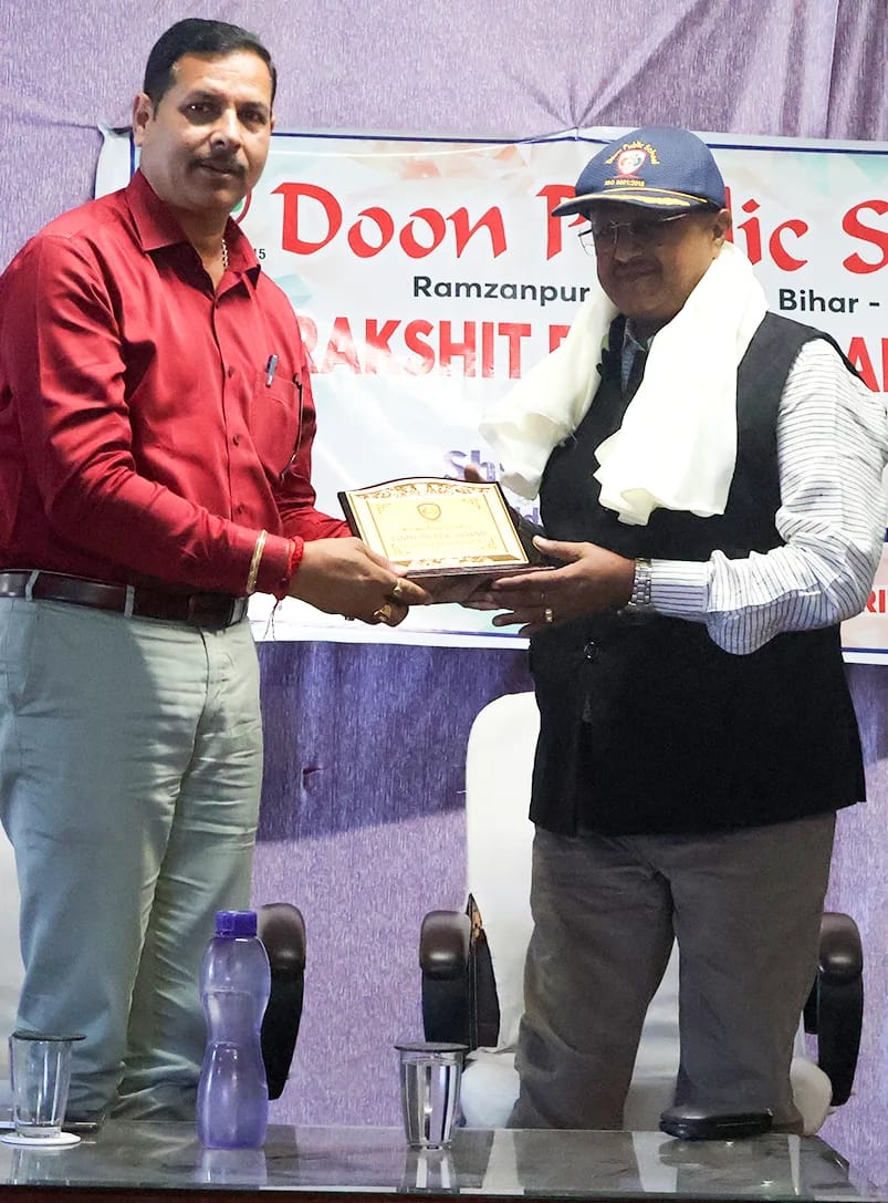 A guest being presented with a memento on stage